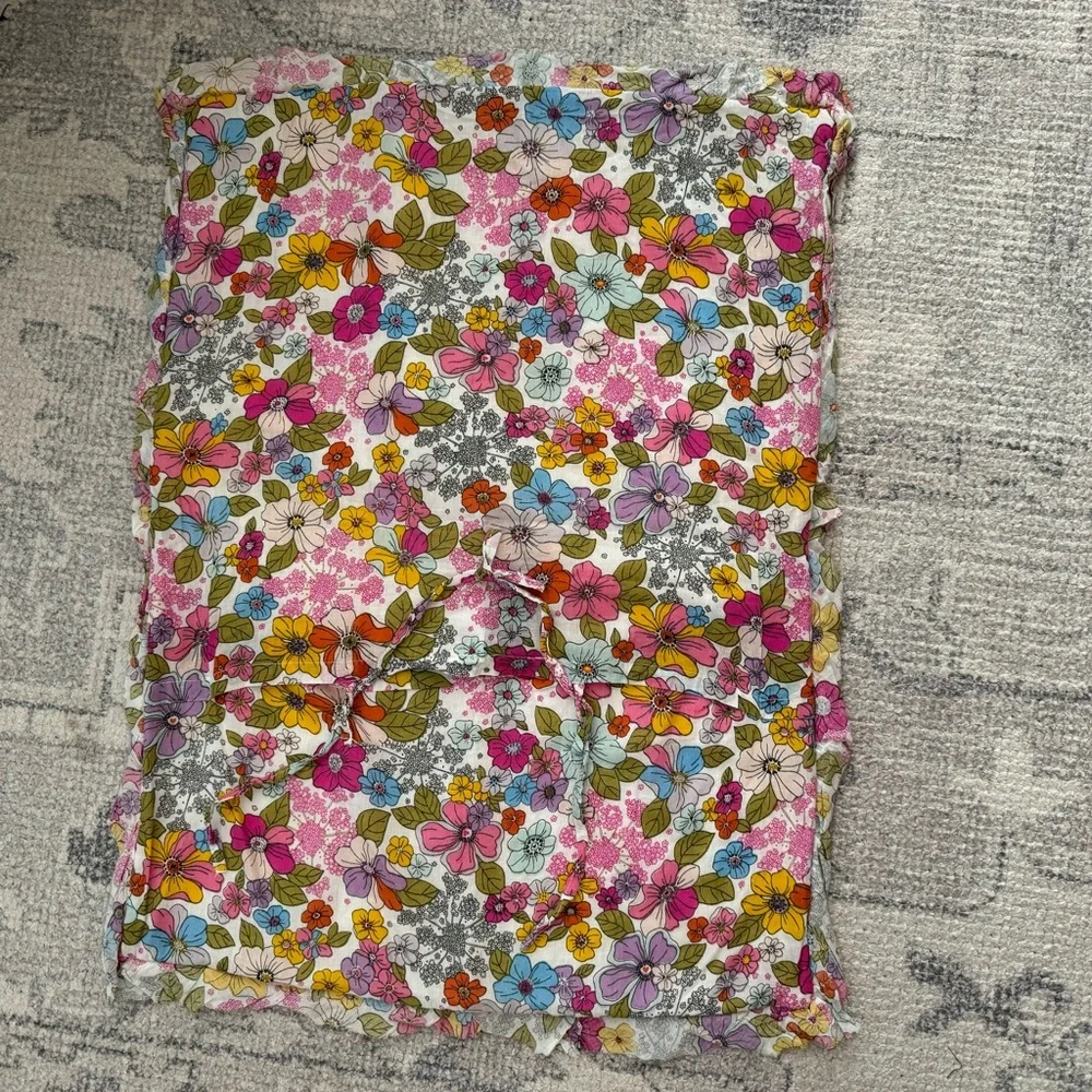 Cynthia Rowley quilted pillow sham with a multicolored boho floral pattern.
